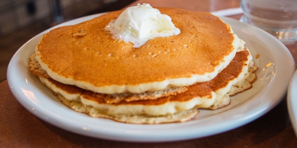 Pancakes served on a table.